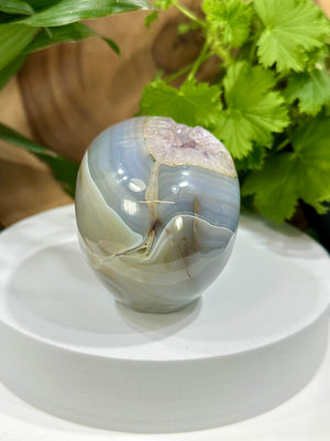 
                  
                    Load image into Gallery viewer, Amethyst Vug in Banded Agate Crystal Skull Carving - Hand Craved and Polished Perfect for Mineral Collectors, Metaphysical Use, Home Decor
                  
                