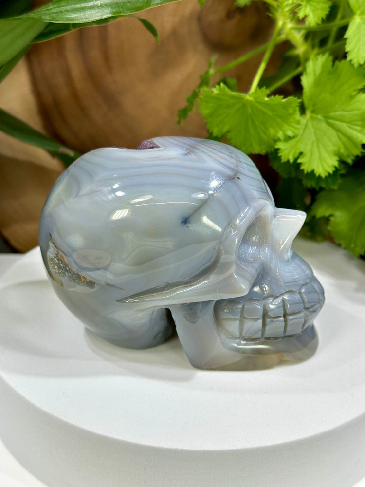 
                  
                    Load image into Gallery viewer, Amethyst Vug in Banded Agate Crystal Skull Carving - Hand Craved and Polished Perfect for Mineral Collectors, Metaphysical Use, Home Decor
                  
                
